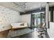 Bright bedroom with a futon and unique modern décor featuring a balcony for relaxation at 195 Arizona Ne Ave # 104, Atlanta, GA 30307