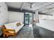 Cozy bedroom with a futon, rocking chair, and balcony with a view of nature, perfect for relaxation at 195 Arizona Ne Ave # 104, Atlanta, GA 30307