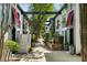 Charming courtyard with walkways, lush greenery, and potted plants between modern townhomes at 195 Arizona Ne Ave # 104, Atlanta, GA 30307