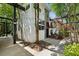 Modern townhome exterior with shade structures, landscaped garden, and string lights at 195 Arizona Ne Ave # 104, Atlanta, GA 30307