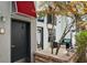 Modern townhome exterior with a patio, seating, and vibrant landscaping at 195 Arizona Ne Ave # 104, Atlanta, GA 30307