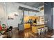 Modern kitchen with stainless steel appliances, an island with barstool seating, and unique lighting at 195 Arizona Ne Ave # 104, Atlanta, GA 30307