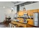 Updated kitchen featuring stainless steel appliances, black granite countertops, and modern pendant lighting at 195 Arizona Ne Ave # 104, Atlanta, GA 30307