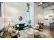 Modern living room features high ceilings, polished concrete floors, and modern furnishings at 195 Arizona Ne Ave # 104, Atlanta, GA 30307