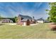 Expansive backyard features a large lawn, perfect for outdoor activities and entertaining at 2417 Saint Feagin Pl, Powder Springs, GA 30127
