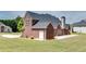 Brick home with large backyard and patio area ideal for outdoor entertaining and relaxation at 2417 Saint Feagin Pl, Powder Springs, GA 30127