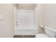 Bright bathroom features a white tiled shower-tub combination and modern fixtures at 2417 Saint Feagin Pl, Powder Springs, GA 30127