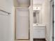 Bathroom featuring a shower and a single vanity with white cabinets at 2417 Saint Feagin Pl, Powder Springs, GA 30127
