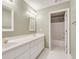 Bathroom featuring double vanity with white cabinets and a shower at 2417 Saint Feagin Pl, Powder Springs, GA 30127