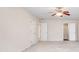 Bedroom featuring neutral walls, carpet, ceiling fan, and access to closets and bathroom at 2417 Saint Feagin Pl, Powder Springs, GA 30127
