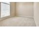 Neutral bedroom showcases a large window and neutral carpet at 2417 Saint Feagin Pl, Powder Springs, GA 30127