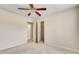 Bedroom featuring neutral walls, carpet, ceiling fan, and access to closets at 2417 Saint Feagin Pl, Powder Springs, GA 30127