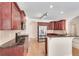 Kitchen featuring granite countertops, stainless steel appliances, and wood cabinets at 2417 Saint Feagin Pl, Powder Springs, GA 30127