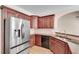 This kitchen features stainless steel appliances, custom wood cabinets, and granite countertops at 2417 Saint Feagin Pl, Powder Springs, GA 30127