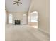Spacious living room with fireplace, high ceilings, and arched doorways at 2417 Saint Feagin Pl, Powder Springs, GA 30127