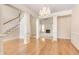 Open-concept living area boasts hardwood floors, and decorative columns at 2417 Saint Feagin Pl, Powder Springs, GA 30127