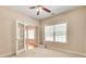 Office with a ceiling fan, double doors, carpet and a large window at 2417 Saint Feagin Pl, Powder Springs, GA 30127