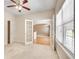 Office with a ceiling fan, carpet, double doors, and natural light at 2417 Saint Feagin Pl, Powder Springs, GA 30127