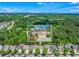 Aerial view of the home's location within a lush, tree-filled neighborhood at 525 Roland Manor Dr, Dacula, GA 30019