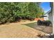 Spacious backyard features a patio and lush green landscaping at 525 Roland Manor Dr, Dacula, GA 30019