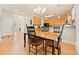 Charming dining room with wood floors adjacent to kitchen at 525 Roland Manor Dr, Dacula, GA 30019