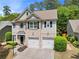 Lovely two-story home with a two-car garage, brick accents, and manicured landscaping at 525 Roland Manor Dr, Dacula, GA 30019
