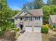 Charming home with a two-car garage, neutral siding, and manicured landscaping at 525 Roland Manor Dr, Dacula, GA 30019