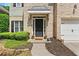 Charming home with a brick facade, neat landscaping, and a welcoming front door at 525 Roland Manor Dr, Dacula, GA 30019