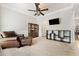 Comfortable living room with carpet, ceiling fan, and stylish decor at 525 Roland Manor Dr, Dacula, GA 30019