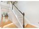 Classic staircase featuring carpeted steps and wood accents at 525 Roland Manor Dr, Dacula, GA 30019