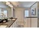 Bright bathroom featuring double vanity, garden tub and glass enclosed shower at 1569 Aiden Way # 35, Conyers, GA 30013