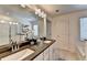 Bright bathroom featuring double vanity, mirror, garden tub and glass enclosed shower at 1569 Aiden Way # 35, Conyers, GA 30013