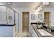 Bright bathroom features a double vanity, glass enclosed shower and entry to walk-in closet at 1569 Aiden Way # 35, Conyers, GA 30013