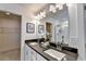 Bright bathroom features a double vanity, mirror, and entry to walk-in closet at 1569 Aiden Way # 35, Conyers, GA 30013