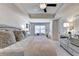 Bright bedroom with tray ceilings, ceiling fan, and ample natural light at 1569 Aiden Way # 35, Conyers, GA 30013