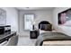 Bedroom with desk, gray carpet, and a picture of red telephone booths at 1569 Aiden Way # 35, Conyers, GA 30013
