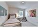 Bright bedroom featuring neutral walls, plush carpet, and a large art piece at 1569 Aiden Way # 35, Conyers, GA 30013
