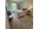 Comfortable bedroom with a luxurious bed, stylish bench, window with natural light and glass table with lamp at 1569 Aiden Way # 35, Conyers, GA 30013
