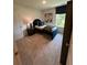 Inviting bedroom features a modern bed with a dark blue frame, stylish decor, and a sunlit window at 1569 Aiden Way # 35, Conyers, GA 30013