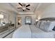 Bedroom featuring a soft color palette, ceiling fan, and access to other room at 1569 Aiden Way # 35, Conyers, GA 30013