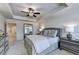 Bedroom featuring a soft color palette, ceiling fan, and ample lighting at 1569 Aiden Way # 35, Conyers, GA 30013