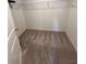 The carpeted walk-in closet features metal shelving and a door at 1569 Aiden Way # 35, Conyers, GA 30013