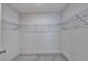 Spacious walk-in closet with wire shelving and carpeted floor at 1569 Aiden Way # 35, Conyers, GA 30013