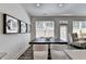 Bright dining room features modern decor, a dark wood table, and wood-look floors at 1569 Aiden Way # 35, Conyers, GA 30013