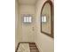 Welcoming entryway with stylish mirror and a view of a wooden front door at 1569 Aiden Way # 35, Conyers, GA 30013