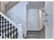 Hallway area with staircase and a view of hallway and doorway at 1569 Aiden Way # 35, Conyers, GA 30013