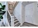 Hallway area with staircase and a view of entryway, featuring hardwood flooring at 1569 Aiden Way # 35, Conyers, GA 30013