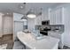 Bright kitchen features a white quartz island, modern pendant lights, and stainless steel appliances at 1569 Aiden Way # 35, Conyers, GA 30013