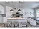 Bright kitchen features a white quartz island, modern pendant lights, and stainless steel appliances at 1569 Aiden Way # 35, Conyers, GA 30013