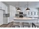 Modern kitchen with white cabinets, subway tile backsplash, stainless appliances, and kitchen island at 1569 Aiden Way # 35, Conyers, GA 30013